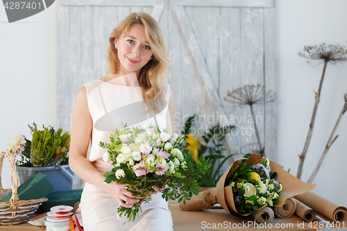 Image of Portrait of blonde with bouquet