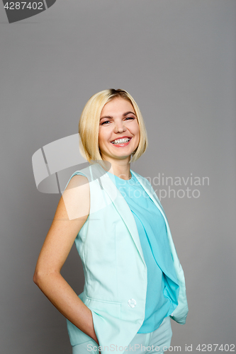 Image of Smiling blonde on empty background