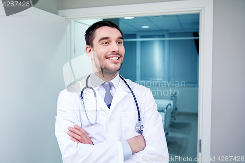 Image of smiling doctor with stethoscope at hospital 