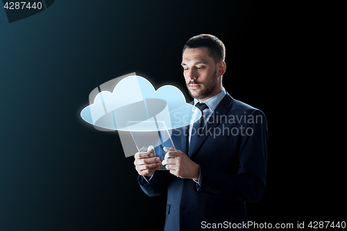 Image of businessman working with transparent tablet pc