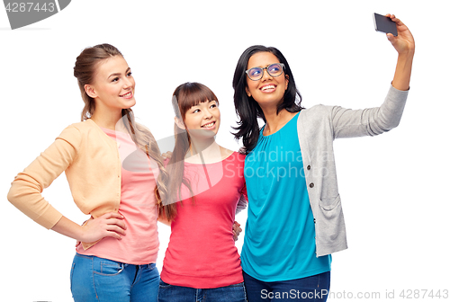 Image of international group of happy women taking selfie