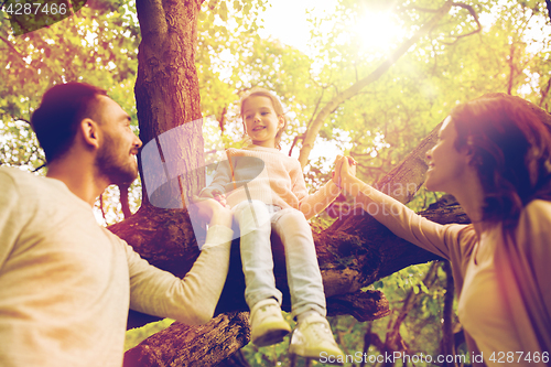 Image of happy family in summer park having fun