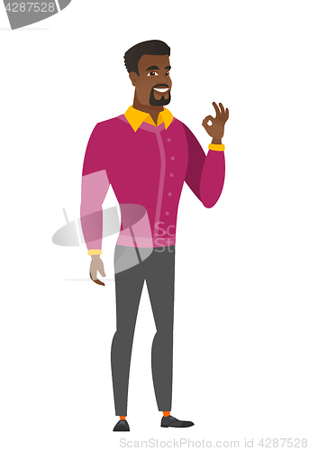 Image of Smiling businessman showing ok sign.