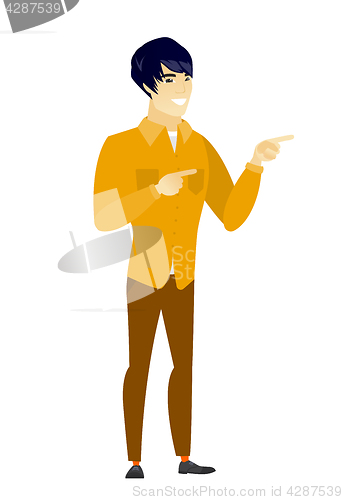 Image of Young asian businessman pointing to the side.