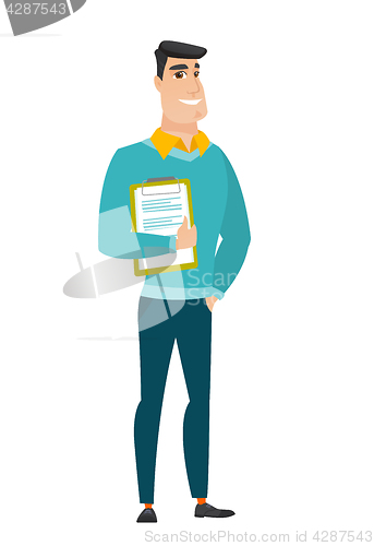Image of Businessman holding clipboard with documents.