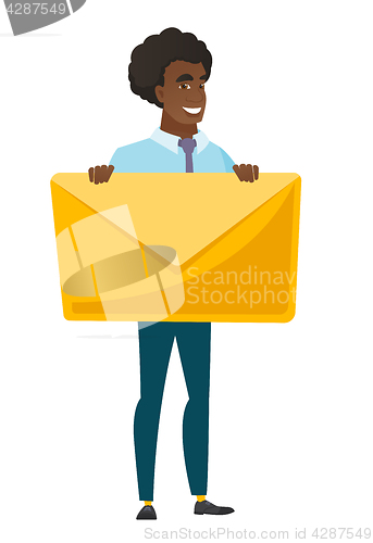 Image of Smiling businessman holding a big envelope.