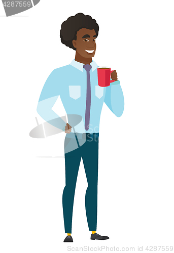 Image of Young caucasian businessman holding cup of coffee.