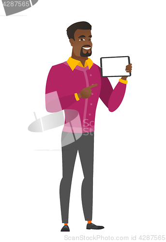 Image of Smiling businessman holding tablet computer.
