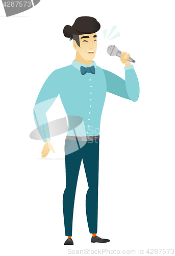 Image of Asian businessman singing to the microphone.