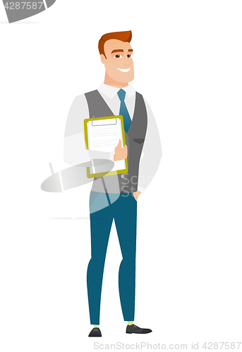 Image of Businessman holding clipboard with documents.