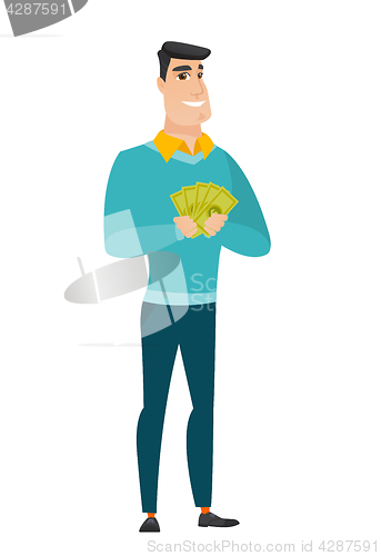Image of Happy caucasian businessman holding money.