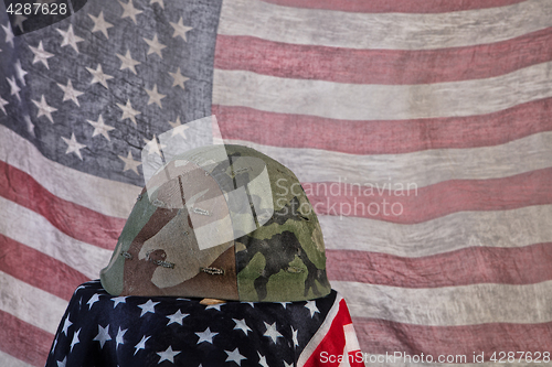 Image of Old Army Helmet And Flag