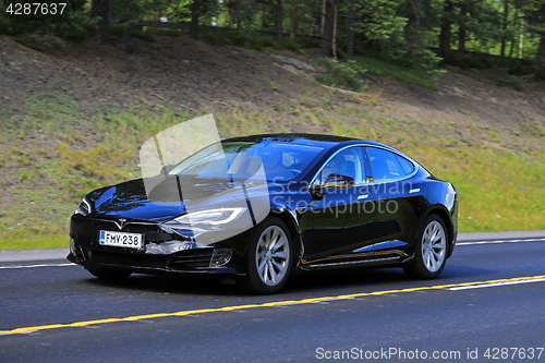 Image of New Black Tesla Model S at Speed