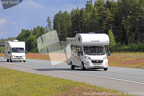 Image of Two Camper Vans on the Road 