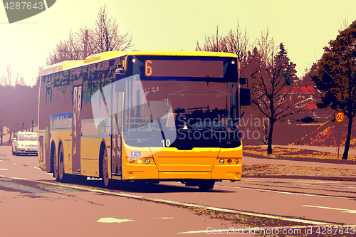 Image of Yellow City Bus Moving in Street Traffic