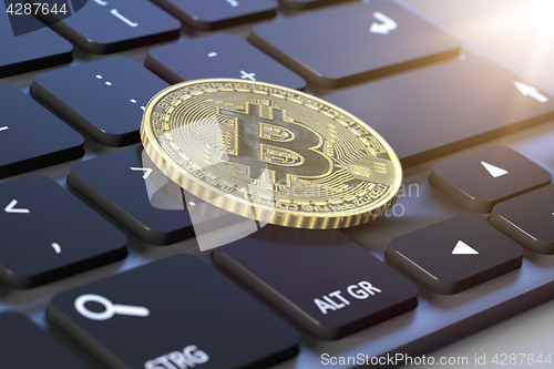 Image of bitcoin coin on a keyboard