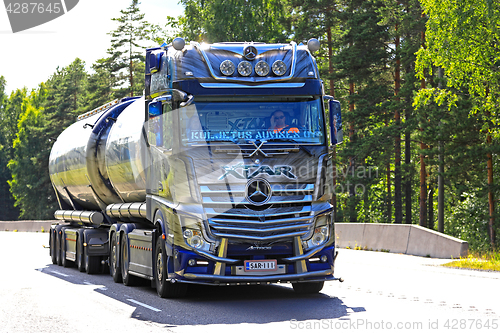 Image of Mercedes-Benz Actros Truck Xtar Hauls Goods along Road