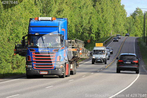 Image of Scania Semi Hauls Wide Load in Traffic