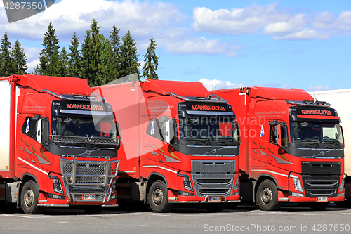 Image of Group of Three Volvo Trucks Parked