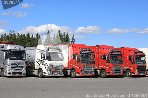 Image of Row of Trucks at Truck Stop