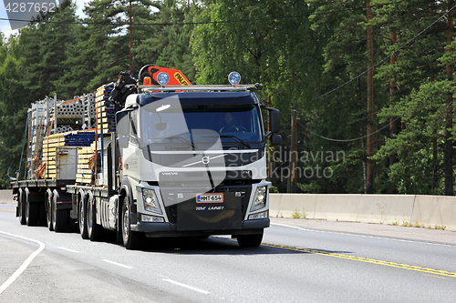 Image of White Volvo FM Hauls Construction Materials