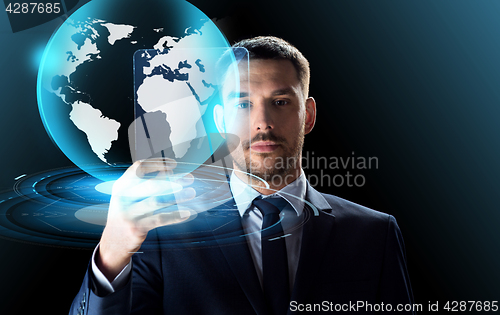 Image of businessman with tablet pc and virtual globe