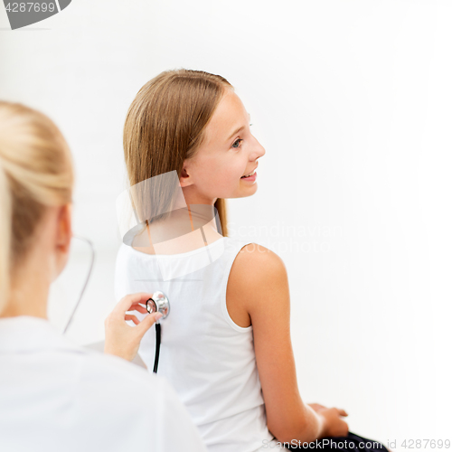 Image of doctor with stethoscope and girl at hospital