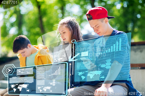Image of teenage friends with smartphones outdoors