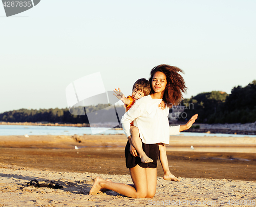 Image of pretty diverse nation and age friends on sea coast having fun, lifestyle people concept on beach vacations close up