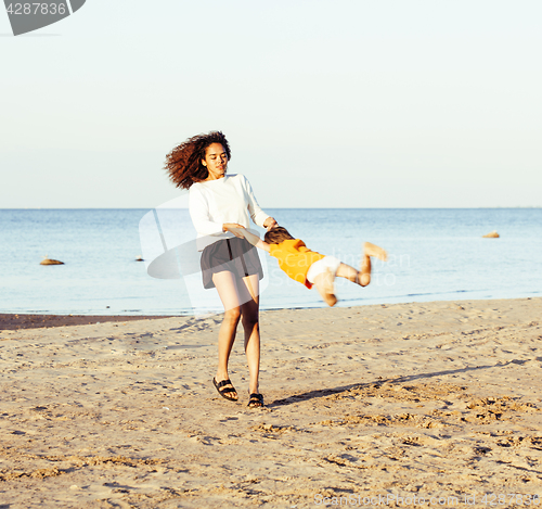 Image of pretty diverse nation and age friends on sea coast having fun, lifestyle people concept on beach vacations close up