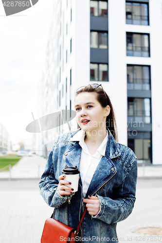 Image of young pretty hipster girl student with coffee cup posing adorable smiling, lifestyle people concept outdoor