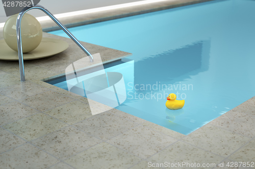 Image of yellow rubber duck in an indoor pool