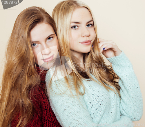 Image of best friends teenage girls together having fun, posing emotional on white background, besties happy smiling, lifestyle people concept close up. making selfie