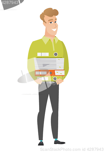 Image of Businessman holding pile of folders.