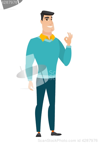 Image of Smiling businessman showing ok sign.