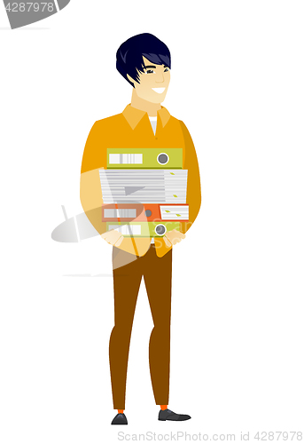 Image of Businessman holding pile of folders.