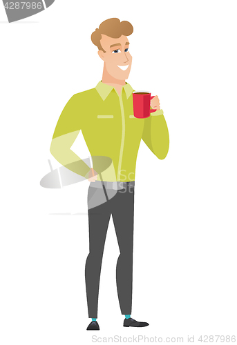 Image of Young caucasian businessman holding cup of coffee.