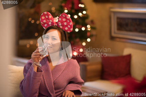 Image of woman drinking champagne at spa