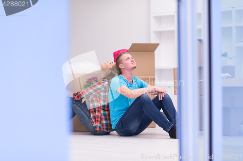 Image of young couple moving  in new house