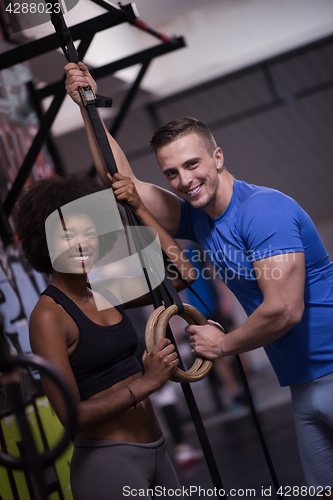 Image of Portrait of multiethnic couple  after workout at gym