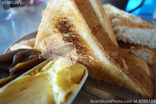 Image of French toast with butter and kaya