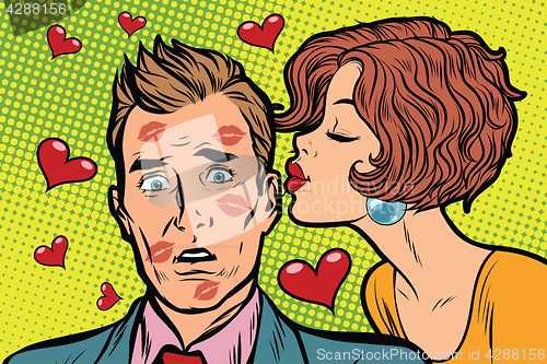 Image of Beautiful woman kissing a man, trace of lipstick