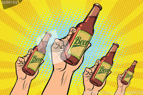 Image of many hands with a bottle of beer