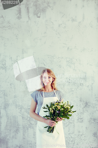 Image of Portrait of florist with bouquet