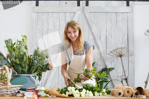 Image of Photo of smiling florist woman