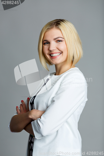 Image of Beautiful girl with arms crossed