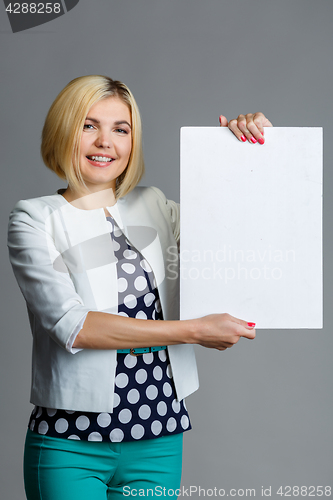 Image of Photo of model with paper