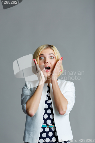 Image of Girl with hands at face