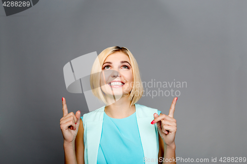 Image of Beautiful woman showing thumbs up