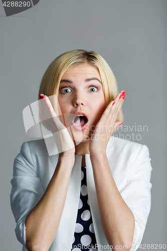 Image of Woman with hands at face